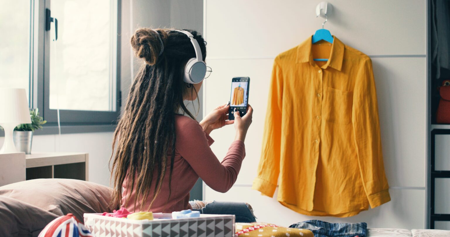 Woman photographing clothes to sell online