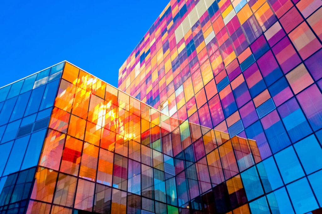Colorful building windows shining in the sunlight
