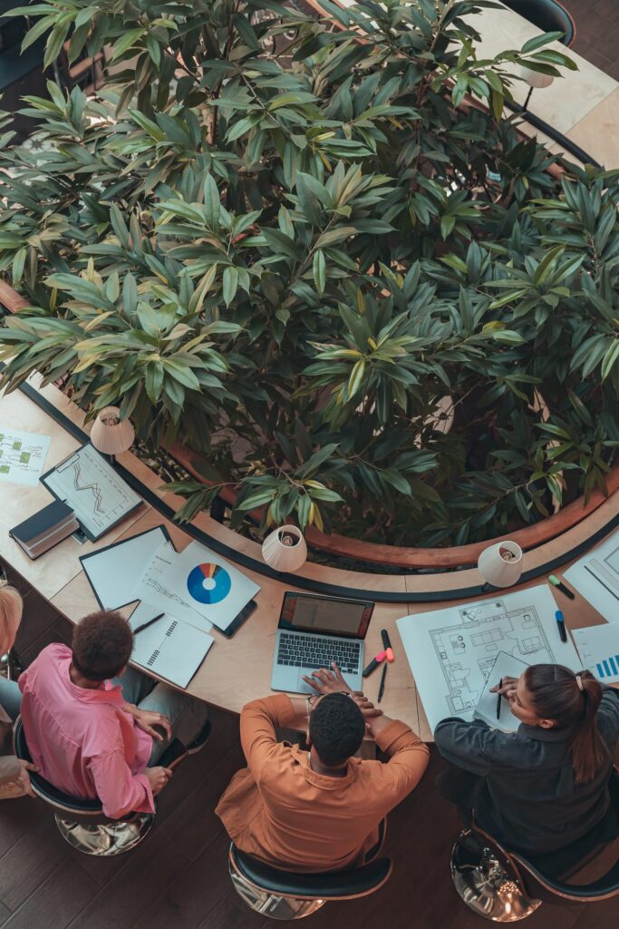Group of coworkers working together using b2b brand tracking.