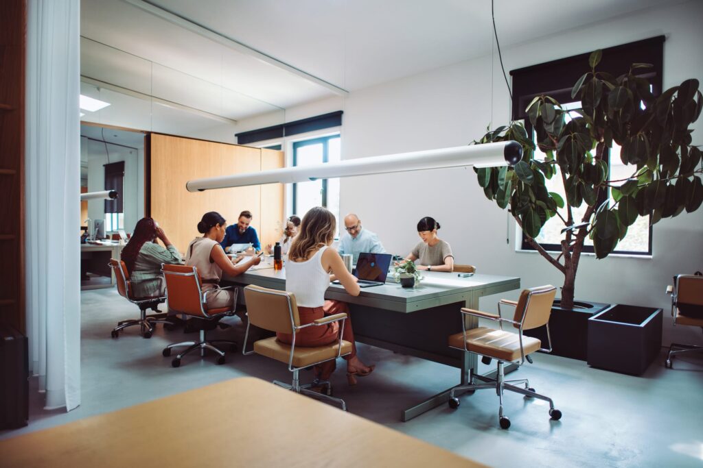 Diverse team working together around a table in a bright modern office
